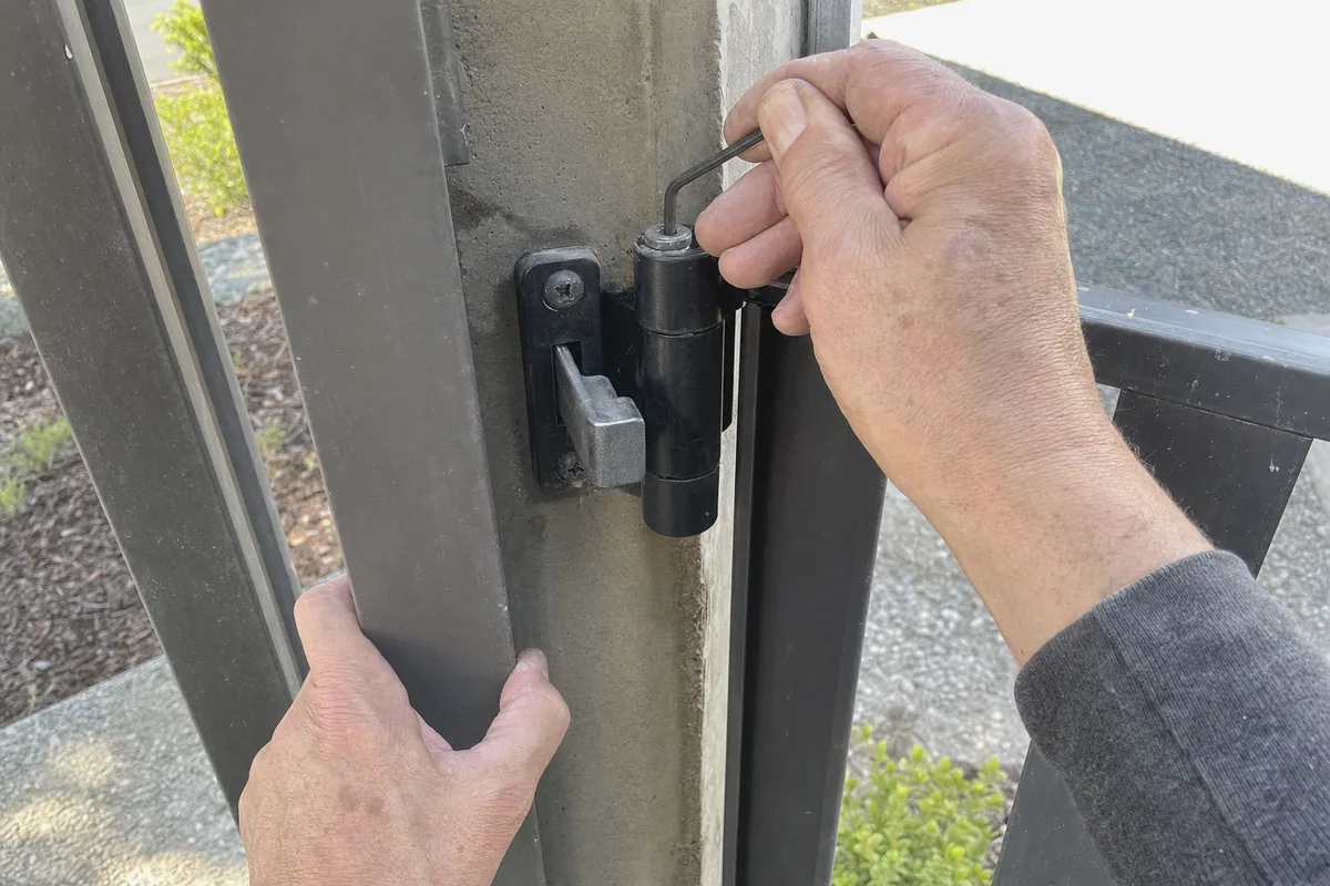 Close-up of pedestrian gate installation work in progress